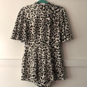Cow print romper! Fits super flattering